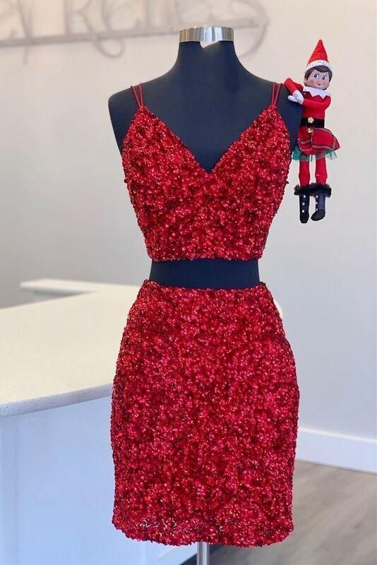 Close-up of the sparkling burgundy sequin fabric on a two-piece short homecoming dress.