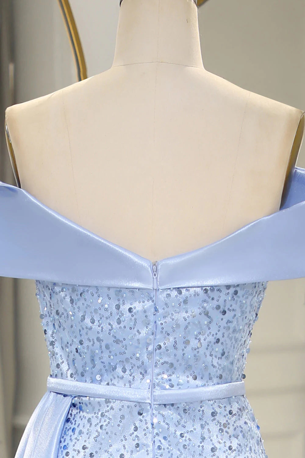 Full-length view of the light blue sequined gown, highlighting its formal silhouette.