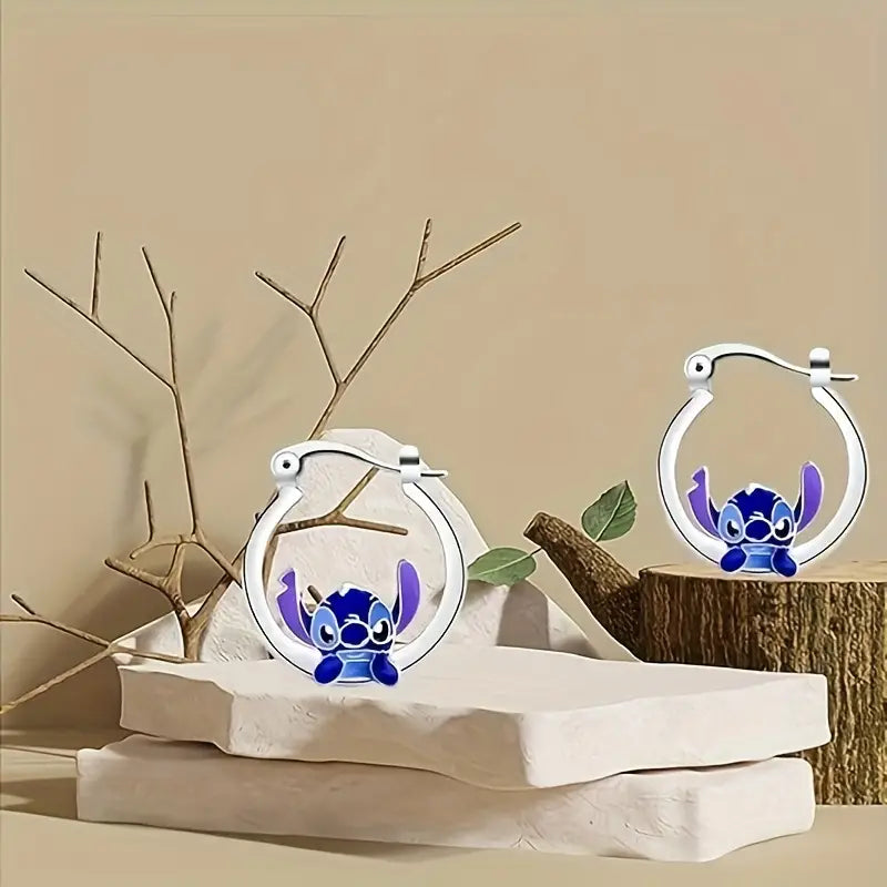 Close-up of Disney inspired alloy hoop earring detail.