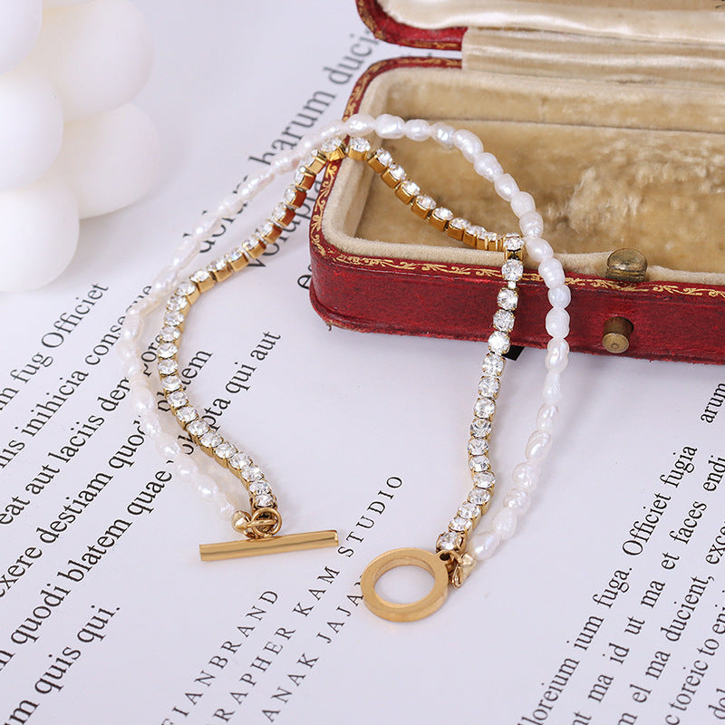 Elegant double-layered bracelet featuring freshwater pearls and sparkling zircon details.