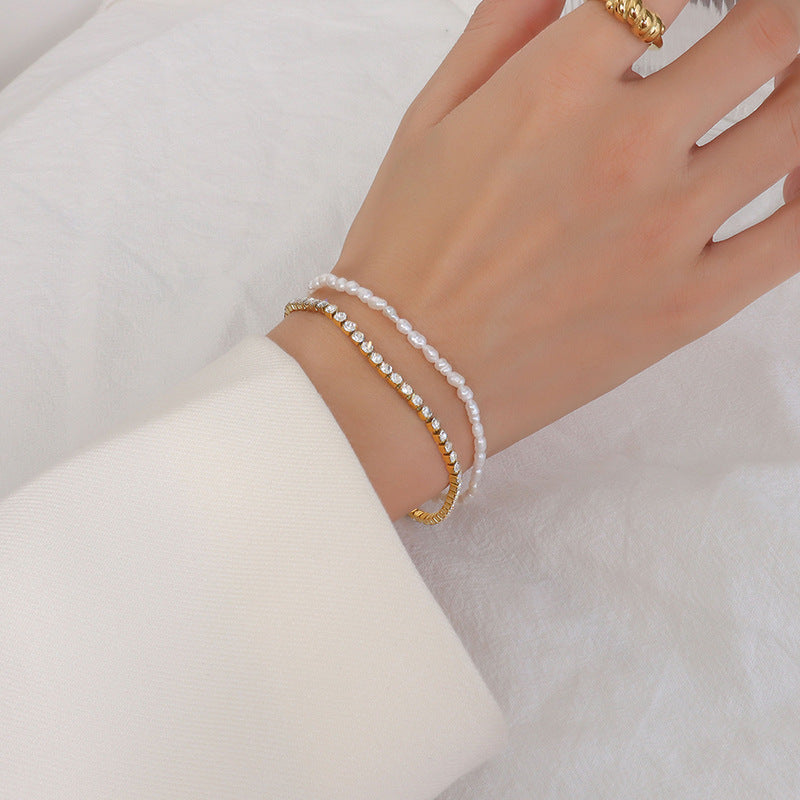Stylish double-layered bracelet with 18K gold plating, pearls, and zircon.
