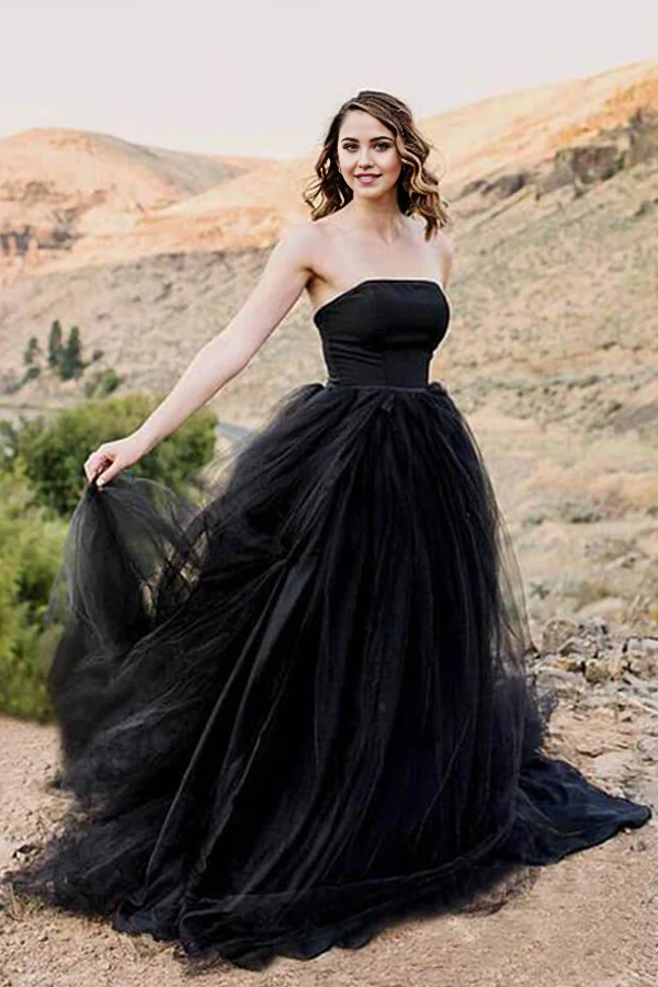 Front view of a Gothic black A-line wedding dress with a V-neck and long train.