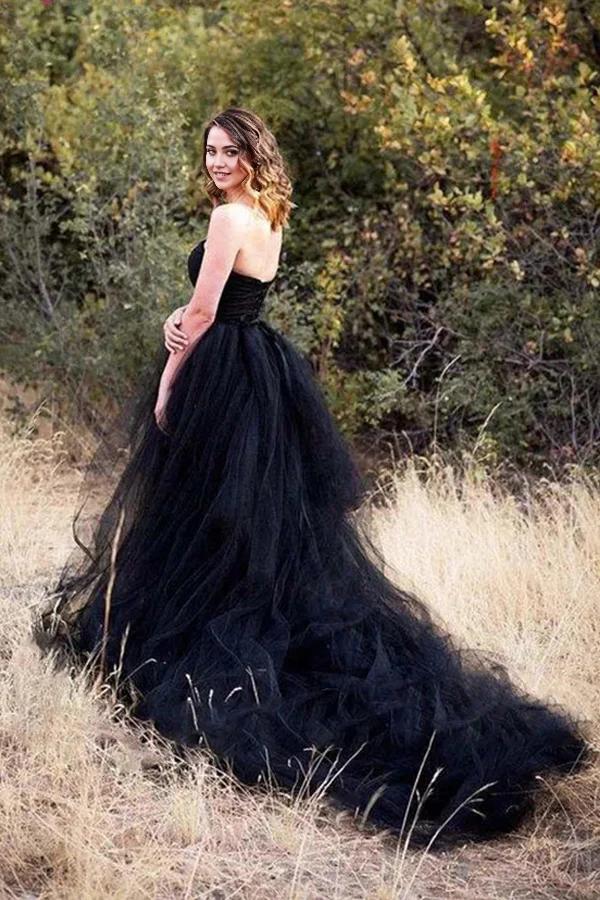 Side view of a sleeveless Gothic black wedding gown, showcasing the A-line silhouette.