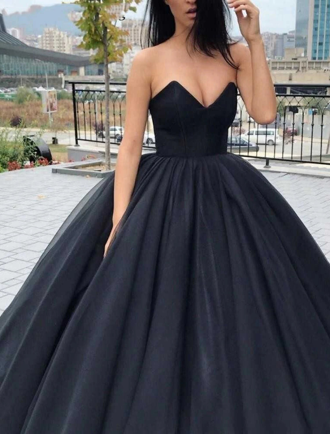 Back view of a black formal wedding dress with a sweetheart neckline and full skirt.