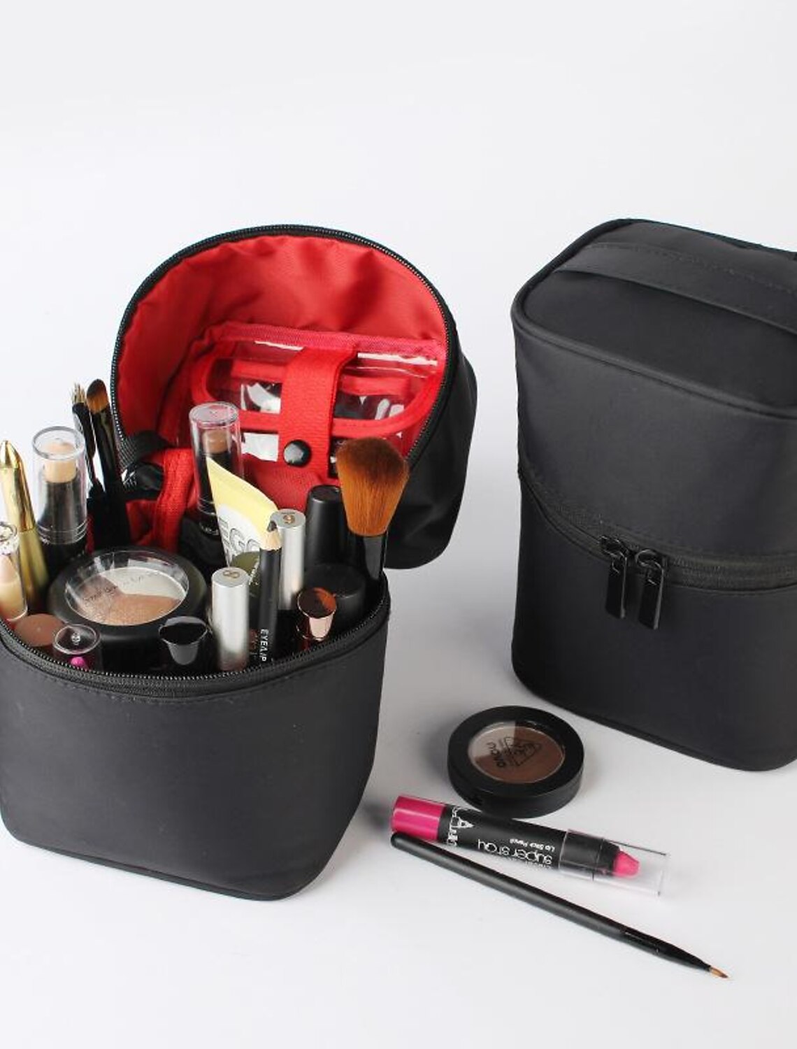 Hard shell travel cosmetic bag with zipper closure.