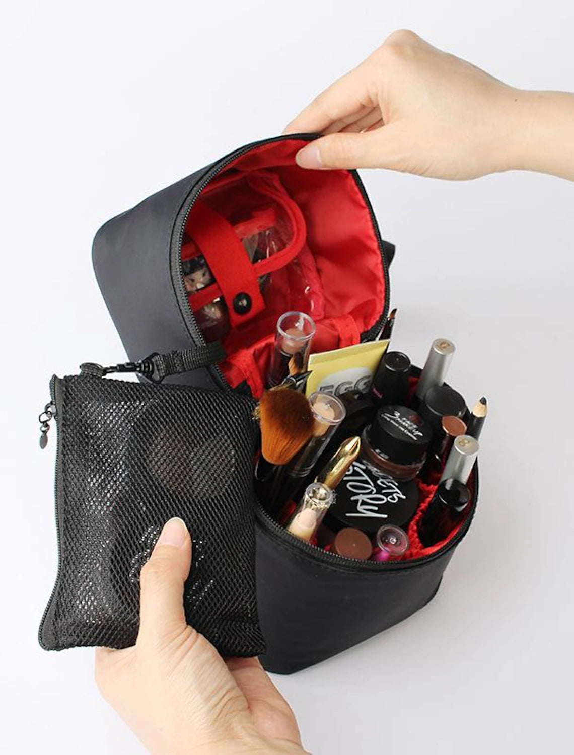 Hard shell wash bag with a sturdy handle for easy carrying.