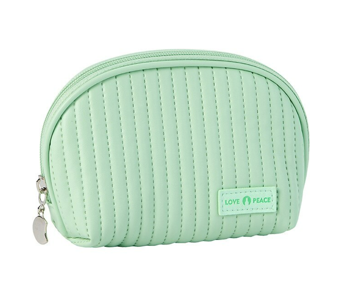 Person carrying a large woven storage bag by its handles.