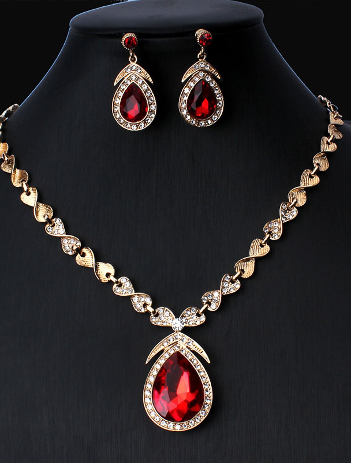 Elegant 18K gold plated jewelry set with white cubic zirconia hoop earrings and necklace.