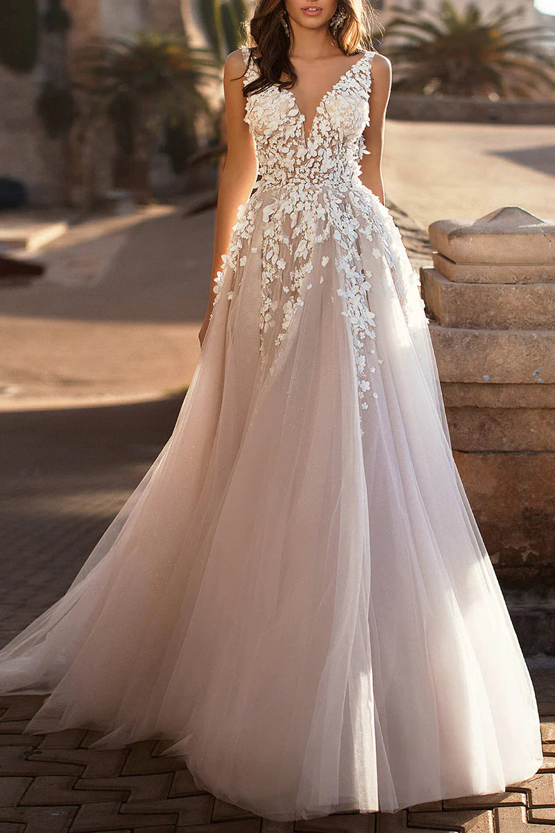 Front view of an elegant A-line 3D lace appliqued wedding dress on a model.