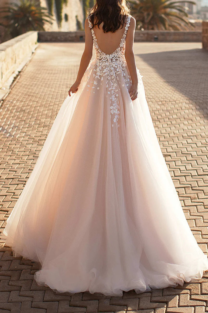 Side view of a model wearing the A-line 3D lace appliqued bridal gown, showcasing the flowing skirt.
