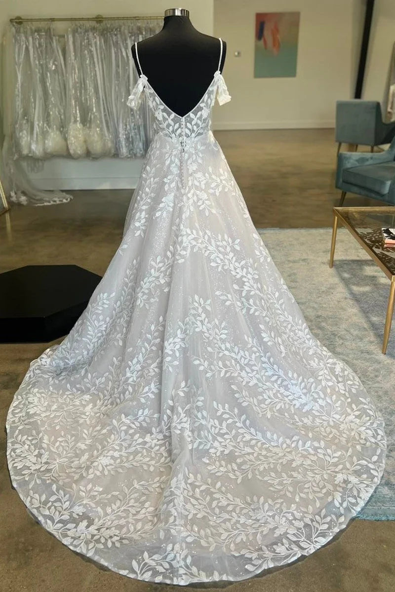 Back view of an A-line appliques wedding dress with a flowing train.