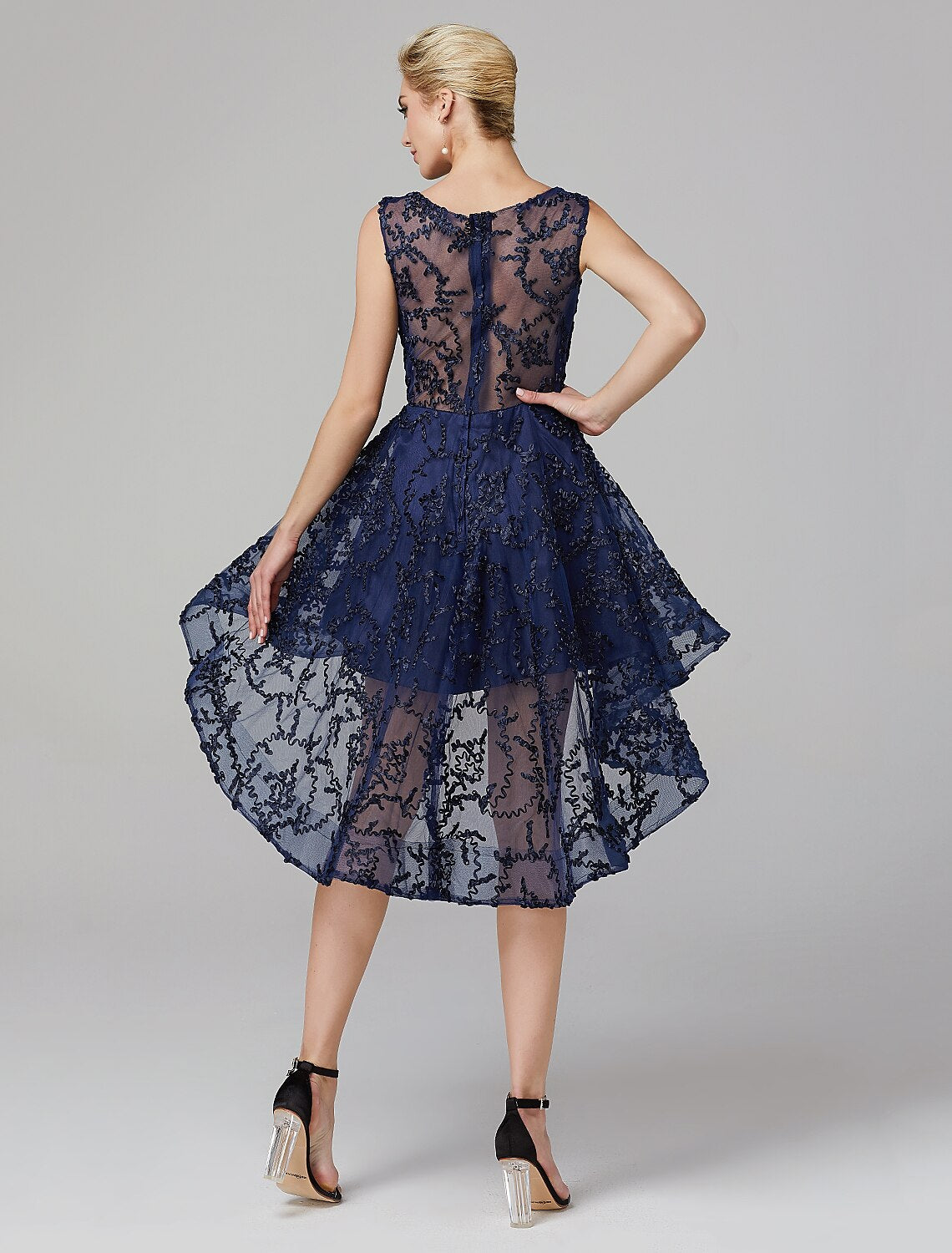 A-line party dress with asymmetrical hem and intricate appliques.