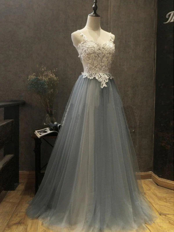 Elegant A-Line backless prom dress with lace and beading details, flowing tulle skirt.