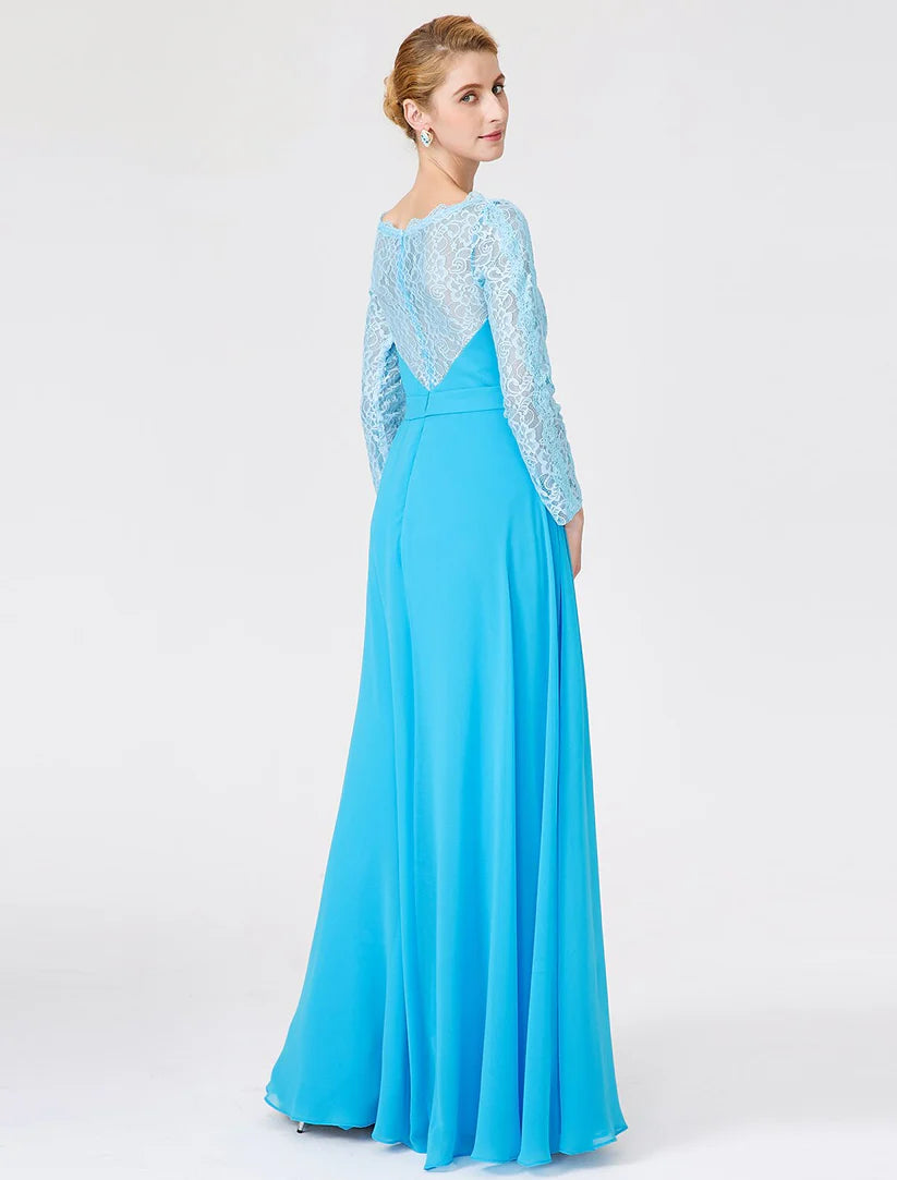 Side view of a woman in a floor-length chiffon lace Mother of the Bride dress with a sash.