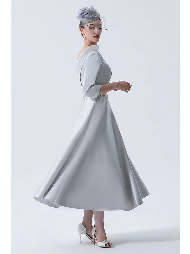 Back view of the elegant A-Line dress, showcasing the tea length and satin fabric.