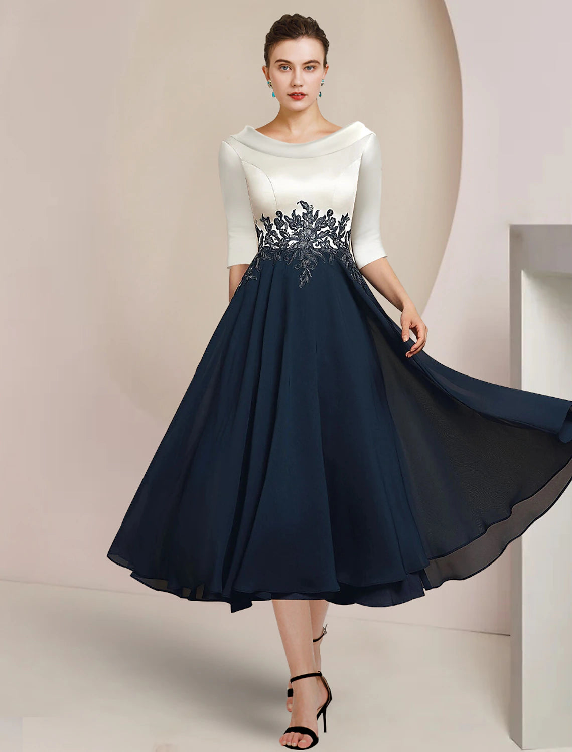 Elegant A-Line Mother of the Bride dress with bateau neck, 3/4 lace sleeves, tea length, and pleats.