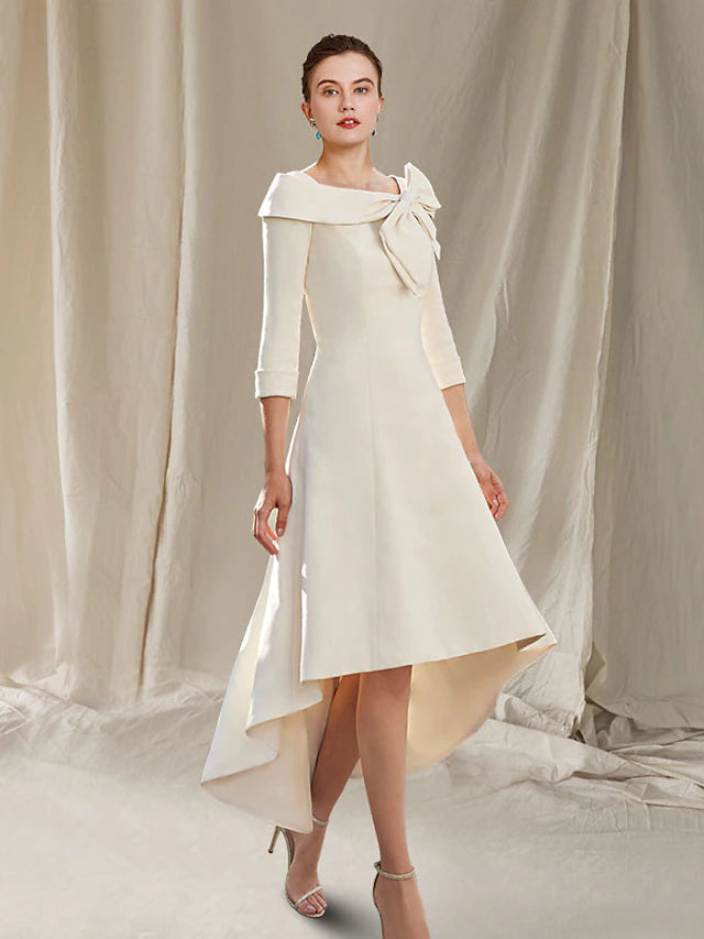 Elegant A-Line Mother of the Bride dress with bateau neck, 3/4 sleeves, high-low hem, and lace bow details.