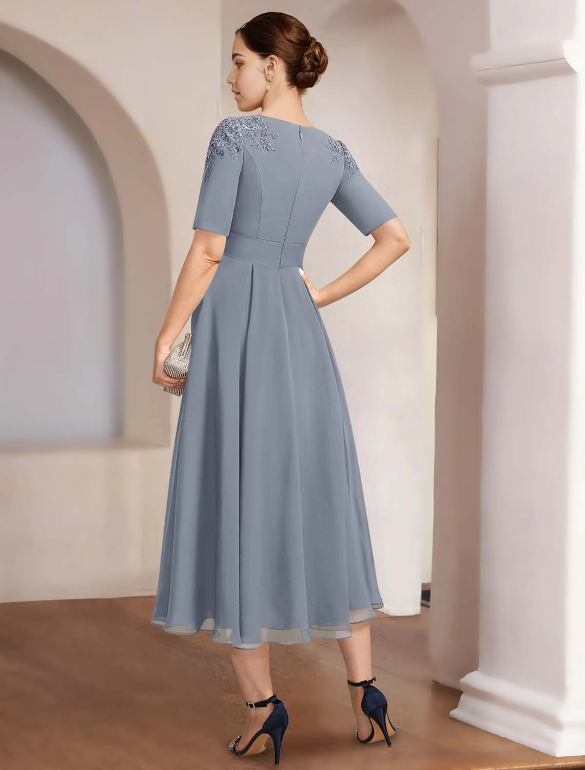 Back view of the A-line chiffon dress, showcasing the elegant drape and ankle length.