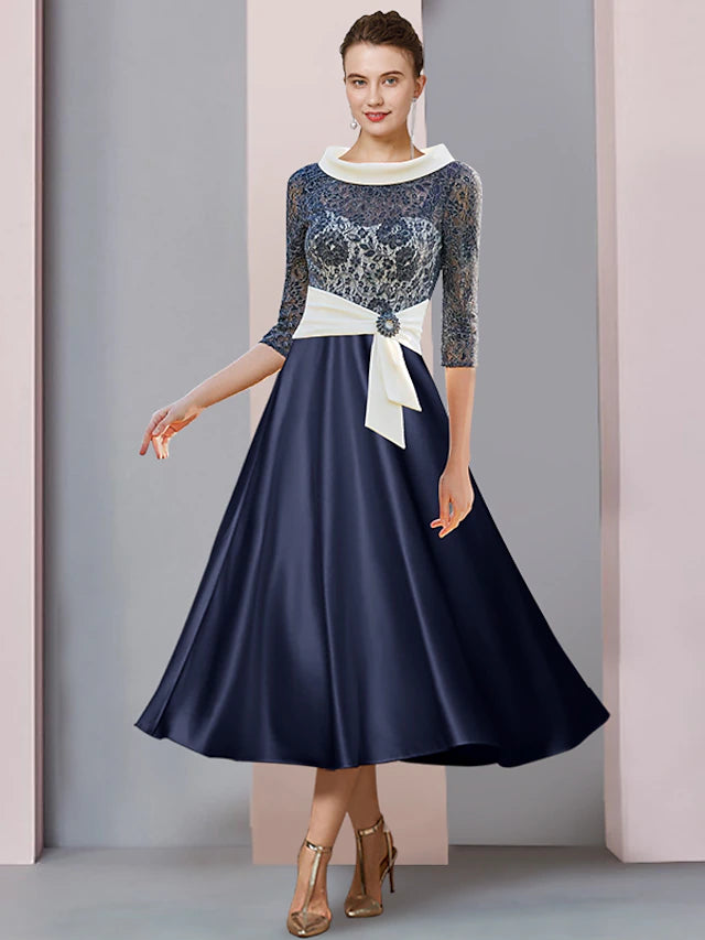 Elegant A-Line tea length dress with bateau neck and 3/4 sleeves.
