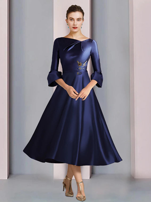 Elegant A-Line Mother of the Bride dress with bateau neck, 3/4 sleeves, tea length, pleats, and beading.