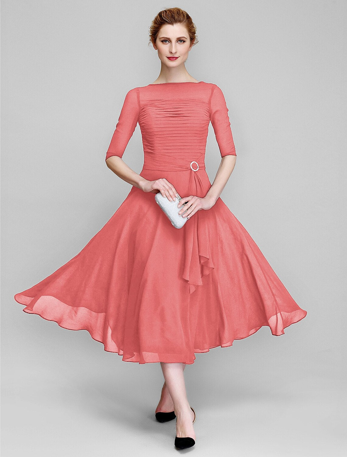 Side view of the plus size chiffon gown, highlighting the half sleeves.