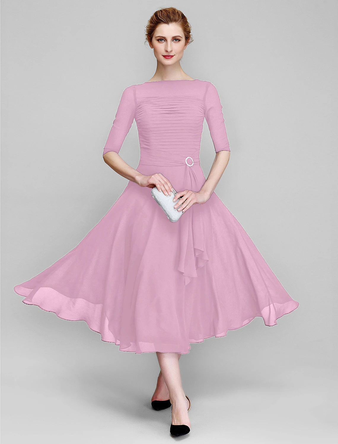 Model wearing the A-Line bateau neck gown, suitable for weddings.