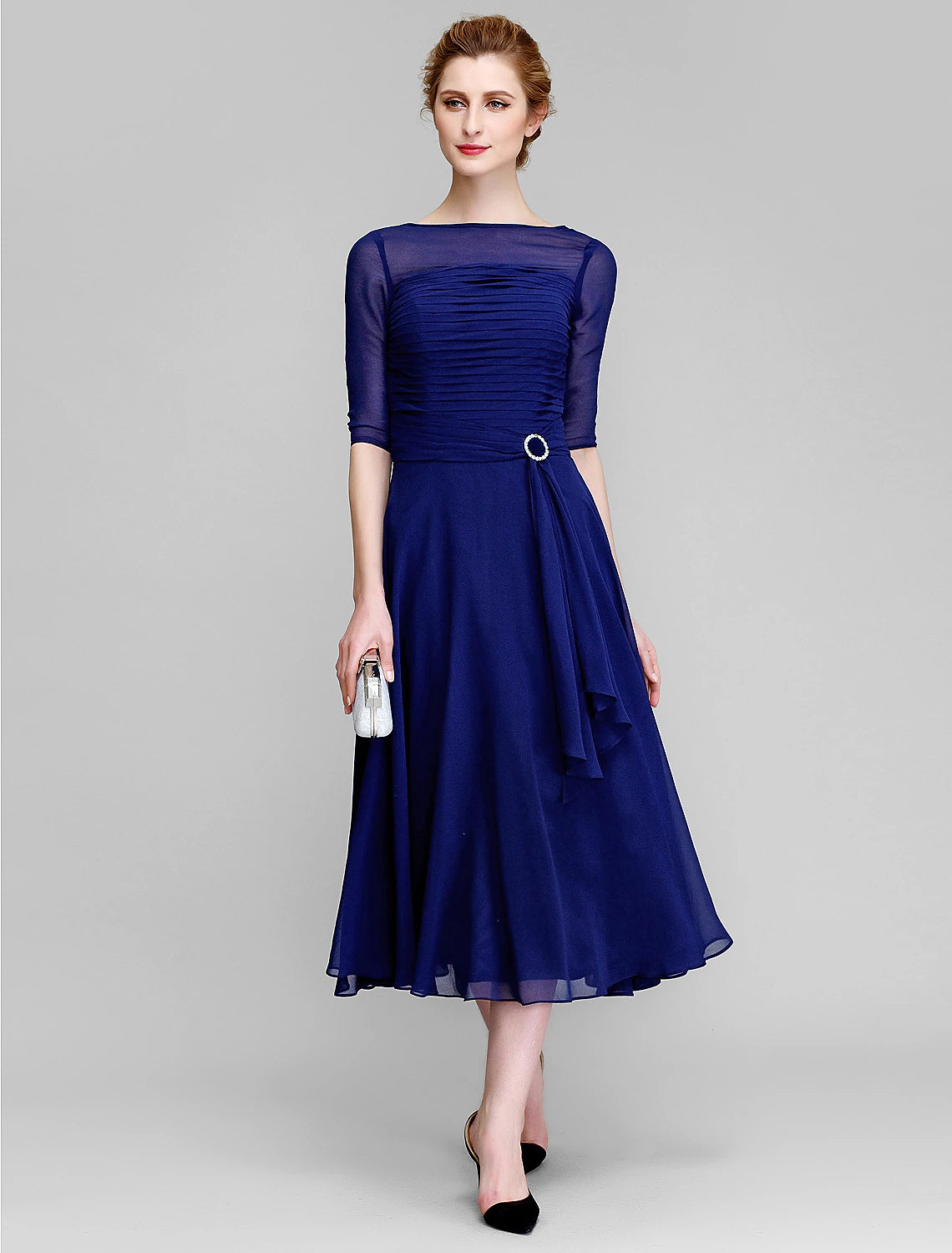 Full length view of the tea length mother of the bride dress.