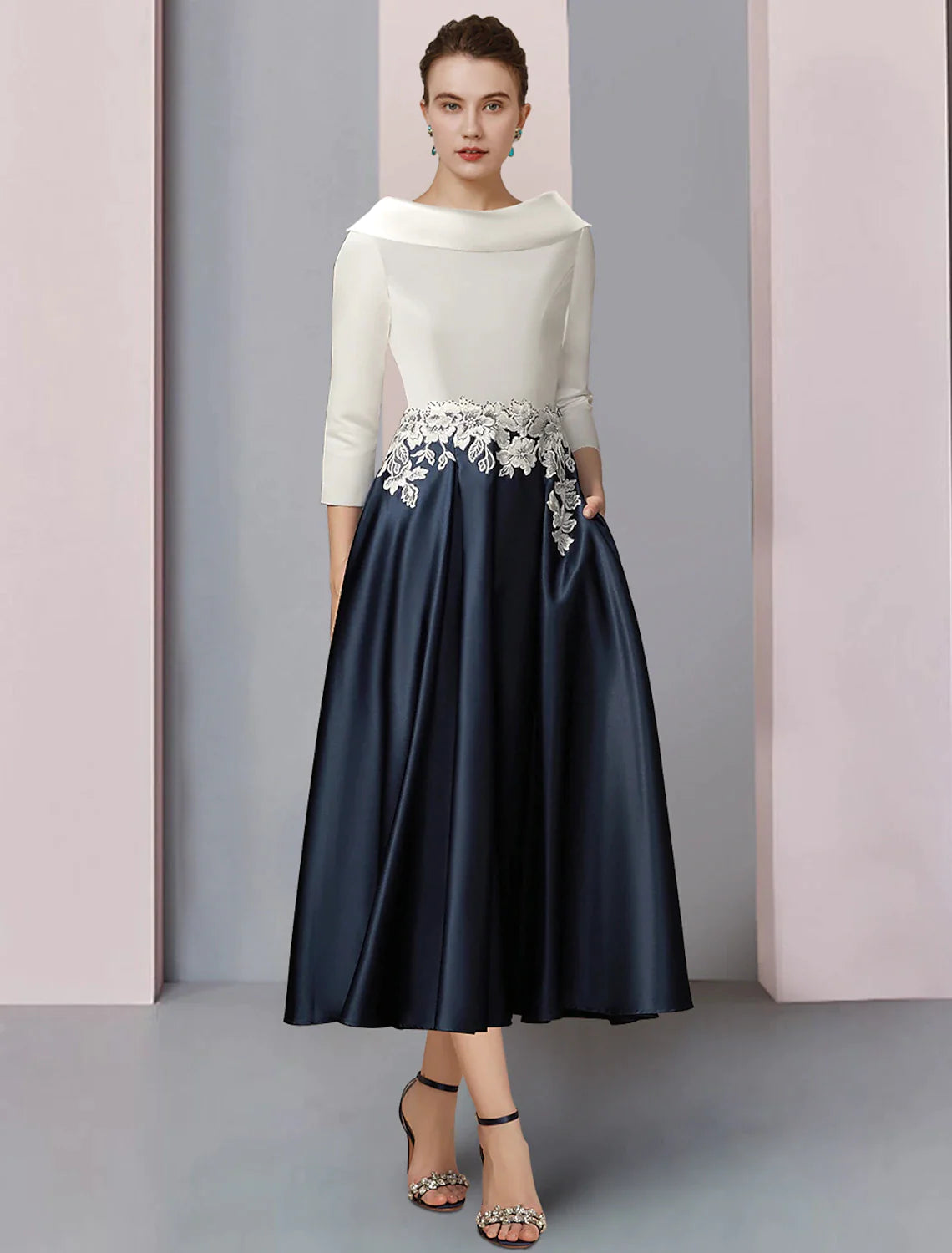 Elegant A-Line Mother of the Bride dress with bateau neck and half sleeves.
