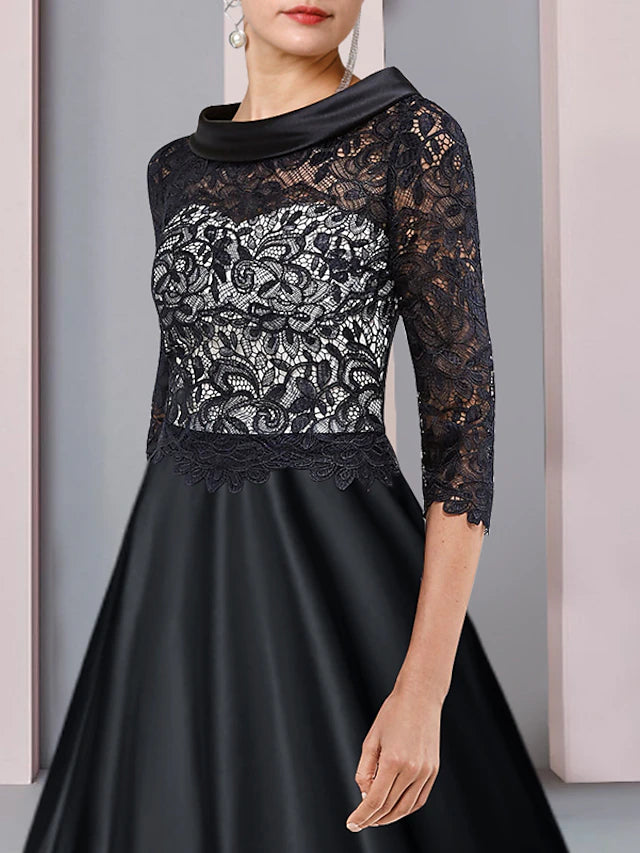 Tea length formal gown featuring satin, lace, pleats, and appliques.