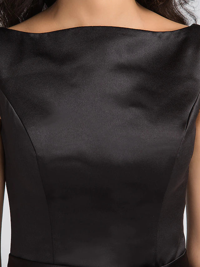 Full length view of a black formal dress with elegant draping.