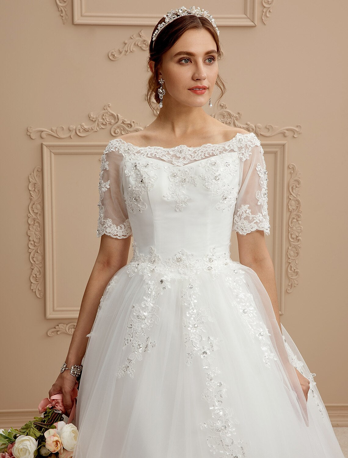 Detail of the lace and tulle fabric combination on the bridal gown.