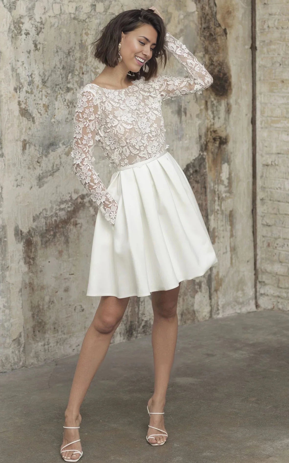 Close-up of the lace detail on the long sleeve A-line wedding dress.