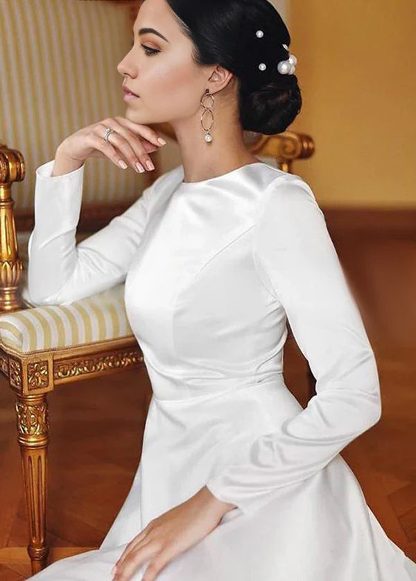 Back view of a vintage-style long sleeve wedding dress.