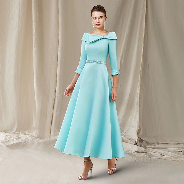 Elegant A-Line Mother of the Bride dress in satin with a bateau neck and 3/4 sleeves, featuring beading and a sash.