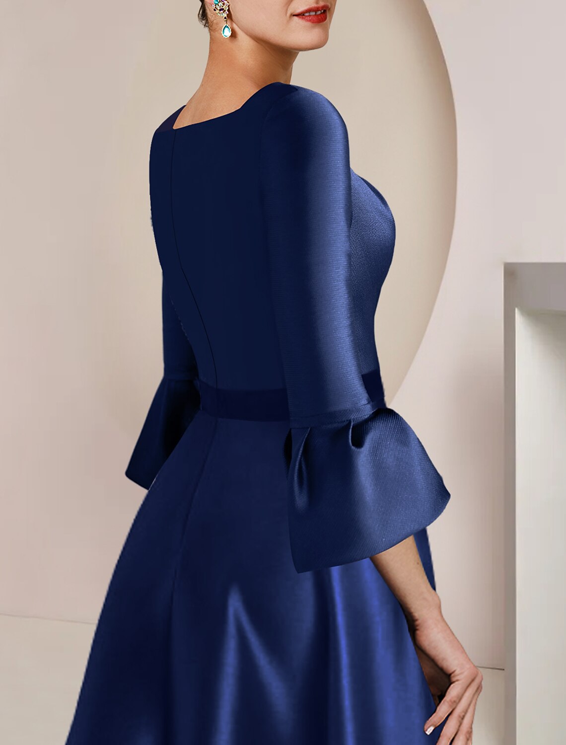 Back view of the formal tea length dress, highlighting the bow detail.