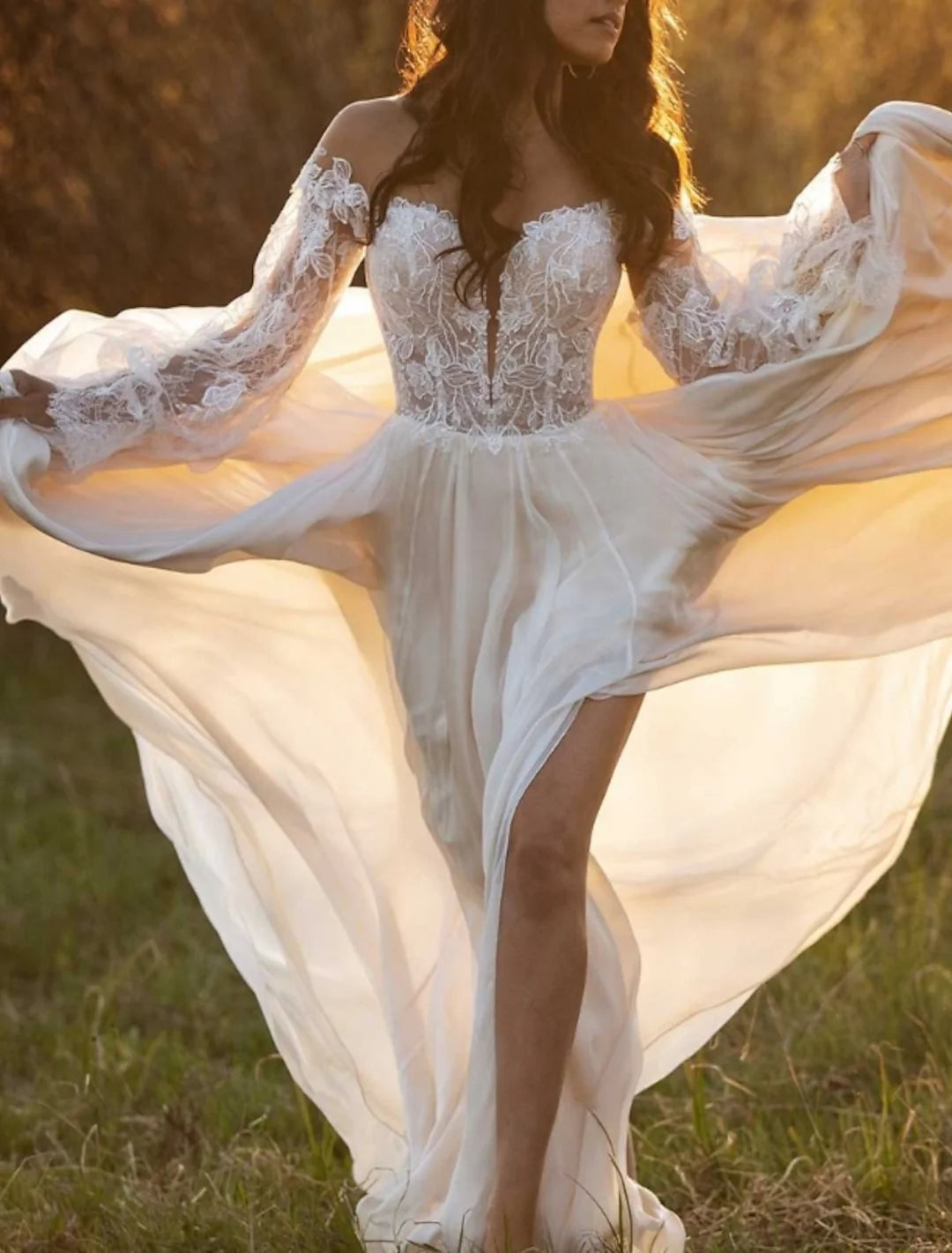 Full view of an A-line beach wedding dress featuring lace details and spaghetti straps.