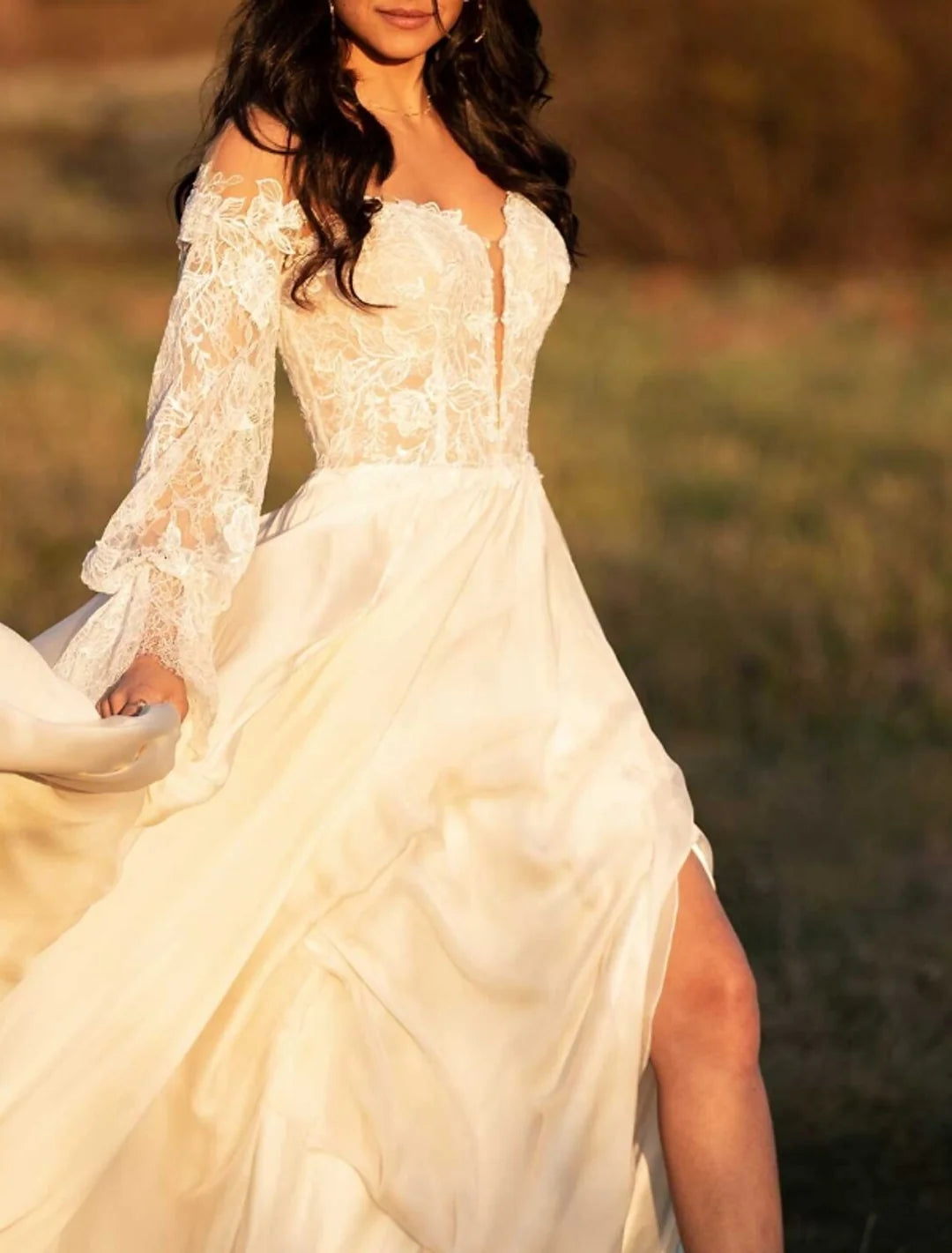 Back view of the A-line beach wedding dress, showcasing the delicate lace and flowing skirt.