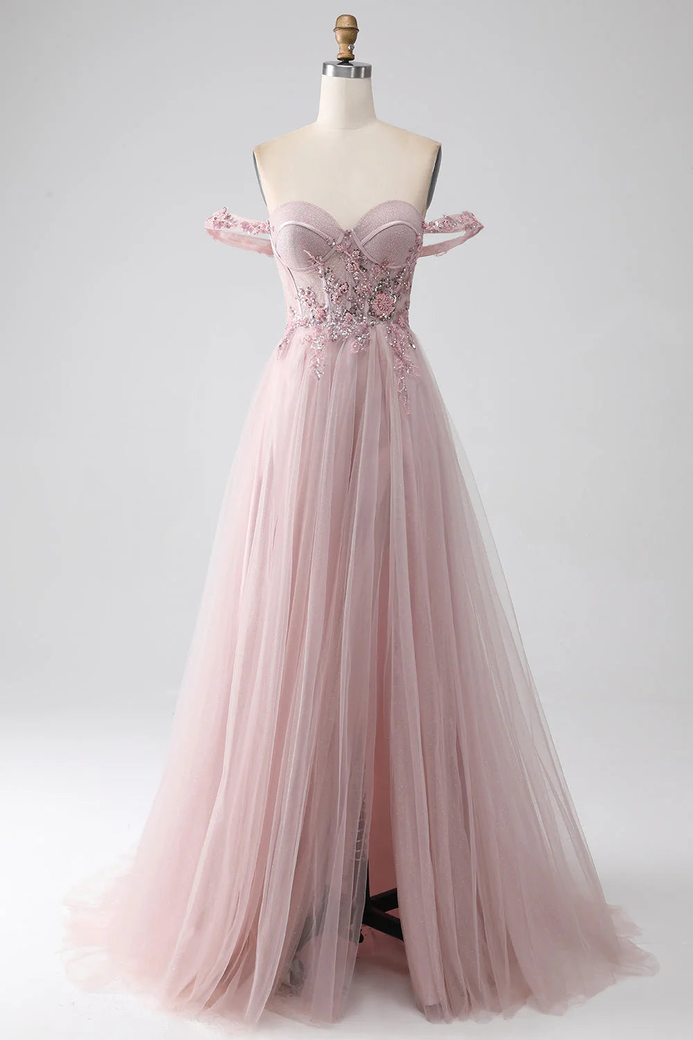 Elegant A-line beaded V-neck prom gown in blush with a high slit.