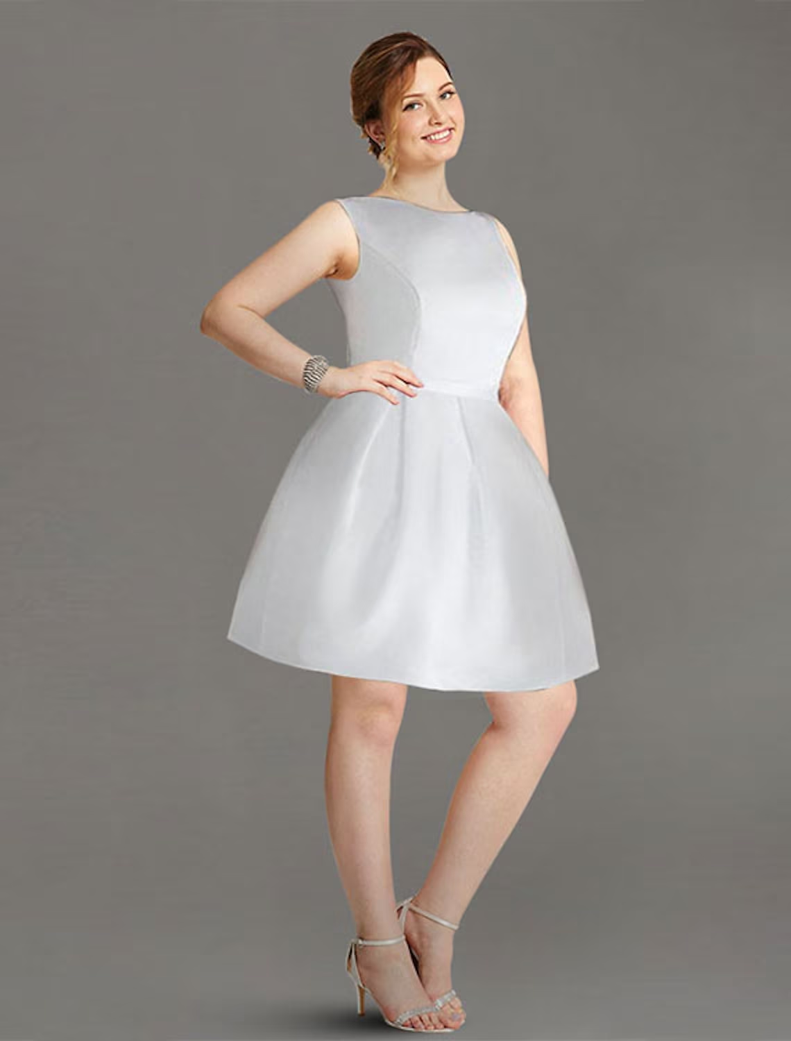 Elegant A-line satin graduation dress with boat neck and knee length.