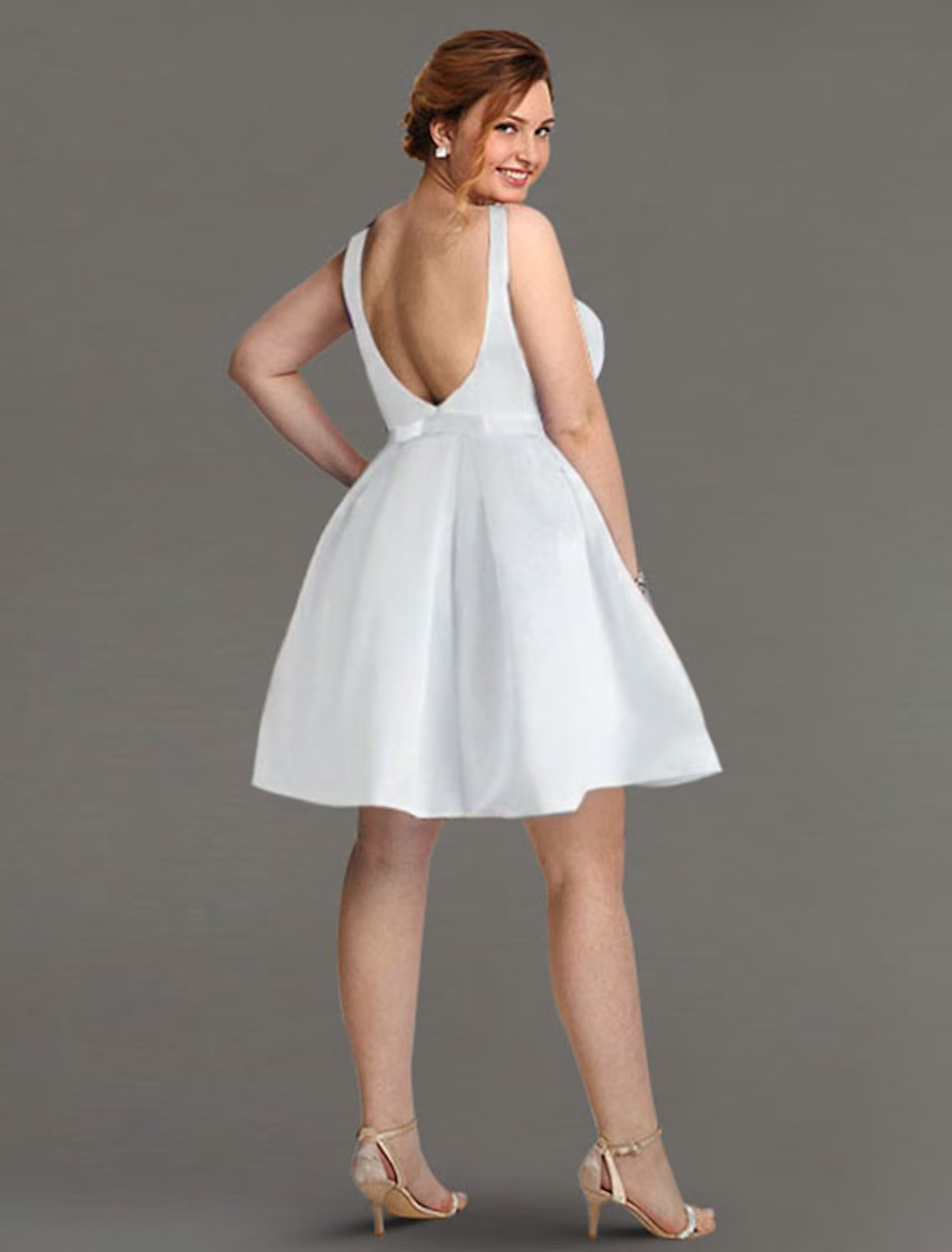 Back view of A-line satin dress showing sleek bow and backless design.