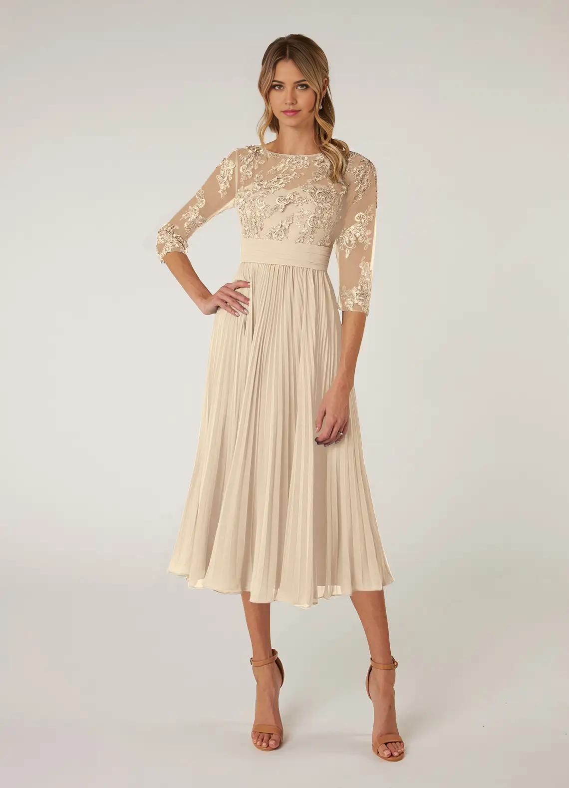 Woman wearing a champagne A-line boatneck Mother of the Bride dress.