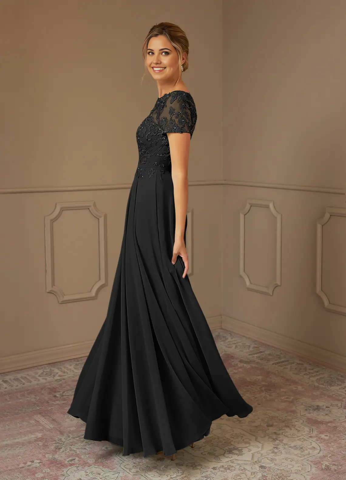 Back view of the elegant black A-line boatneck dress.