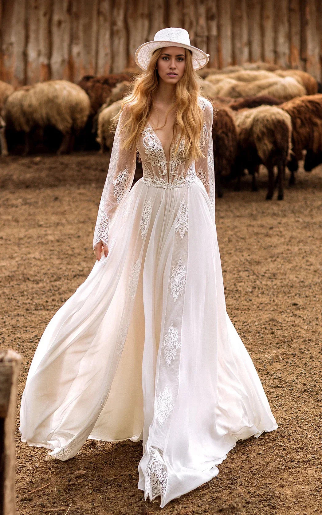 Elegant A-Line boho wedding dress with lace sleeves and plunging neckline.