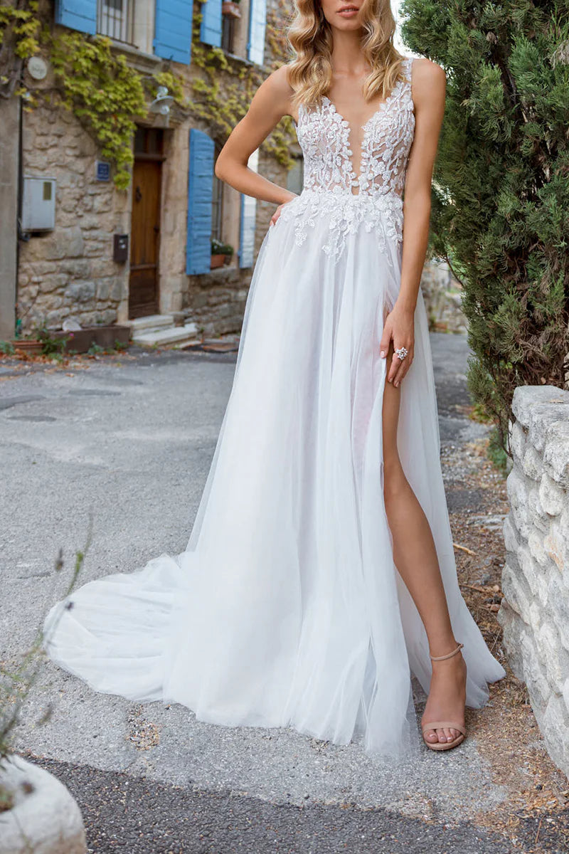 Side view of the sleeveless A-line wedding dress with bohemian details.