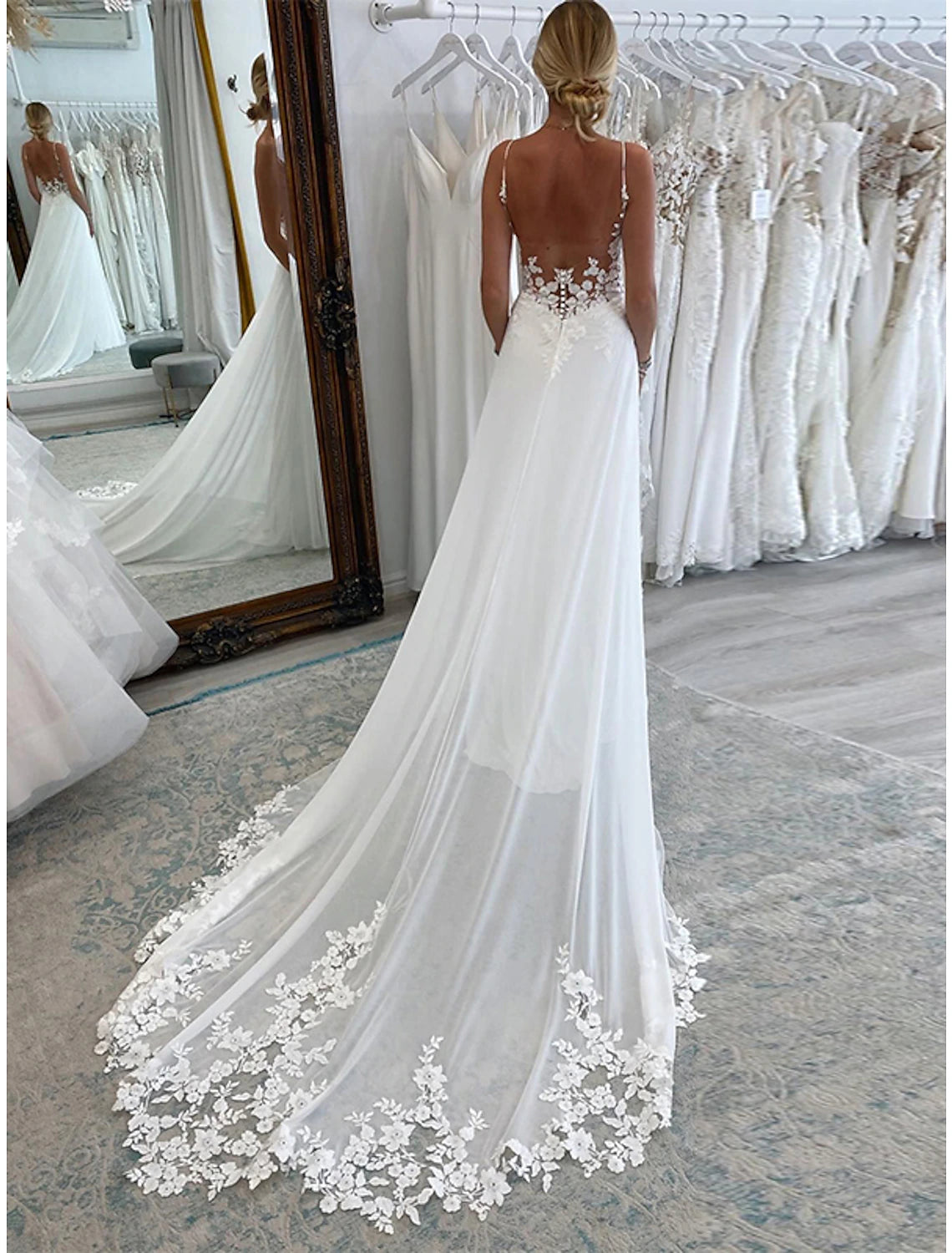 Back view of the A-line chiffon wedding dress showing the court train.
