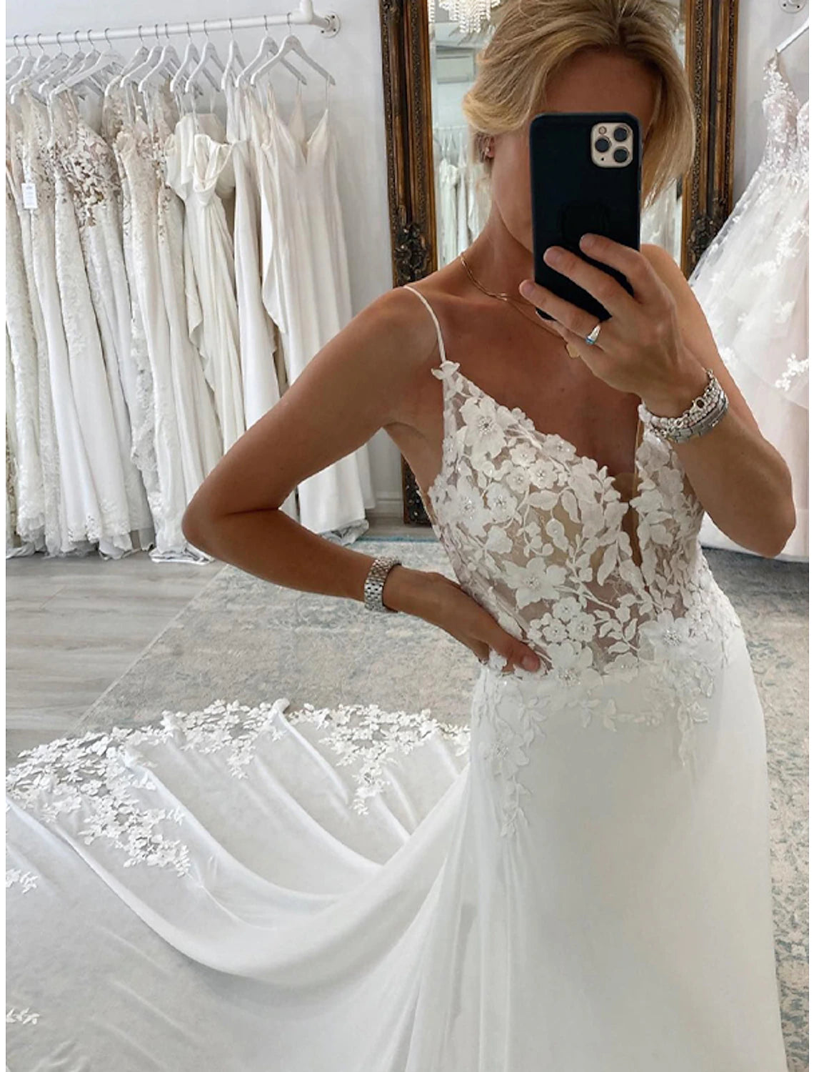 Close-up of the delicate appliques on the A-line chiffon wedding dress.
