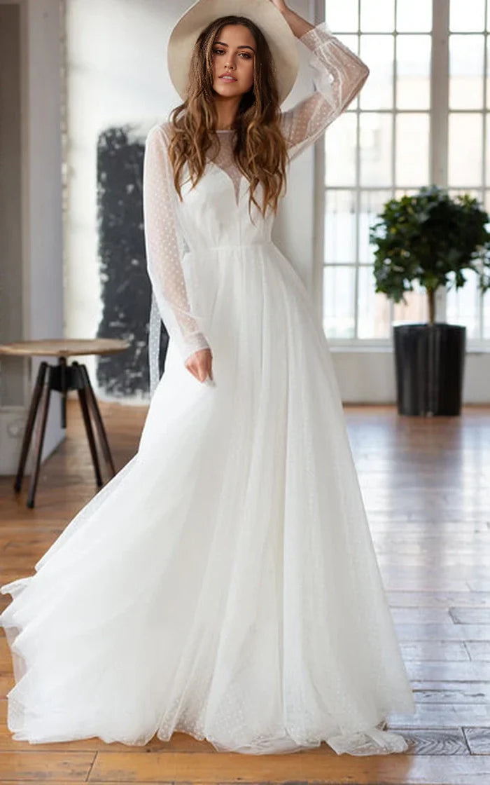 Elegant A-Line chiffon wedding dress with long sleeves and beaded bateau neckline.