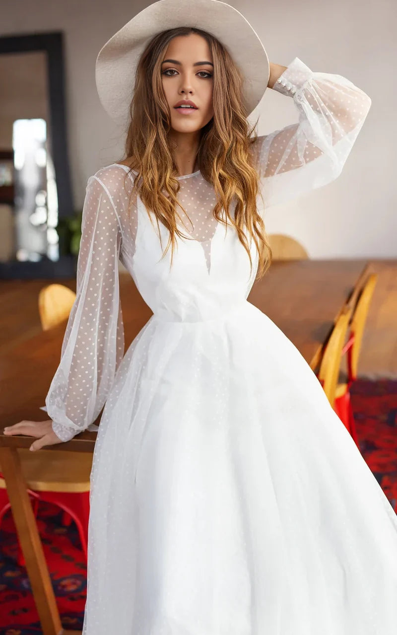 Full view of a long sleeve A-Line wedding dress with intricate beading.