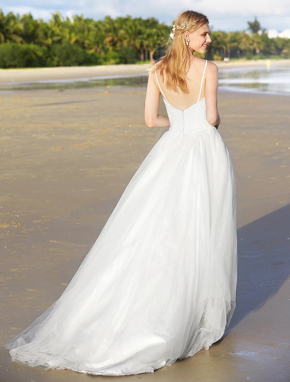 Back view of A-Line chiffon bridal gown with sweep train.