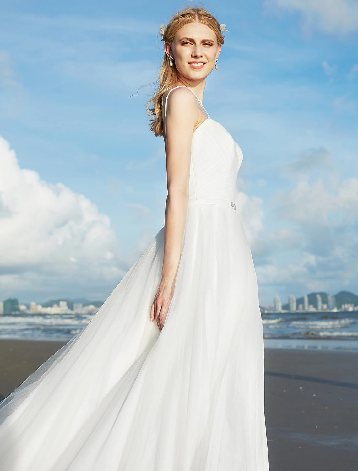 Detail of the spaghetti straps on the bridal gown.